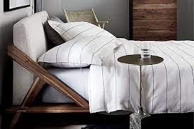 A minimalist wooden plank floating nightstand for holding just a couple. 19 Small Side Tables For When Every Nightstand Is Too Damn Big For Your Room Architectural Digest