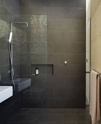 Several space saving devices were used in this small bathroom. Small Dark Bathroom Design