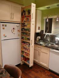 the narrow cabinet beside the fridge