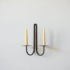 Accent shelves, hanging candle sconces, plaques, mirrors, and clocks. Iron Wall Candle Holder Double Arm June Iron Candle Holder Iron Candle Wall Candle Holders