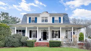A magnificent dutch colonial home with a flowing interior design in indigo, orange and neutrals. House Lust A Sweet 1910 Dutch Colonial In Barrington Rhode Island Monthly