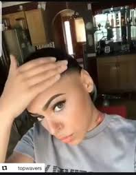 What does a female co-worker's lack of introduction to a wife at a work  event reveal about her?