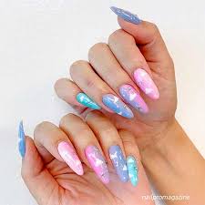 Best Trendy Cloud Nails For Winter Season Stylish Belles Back view of woman throwing in air holi paints near multicultural friends.