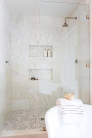 While marble both looks beautiful and proves itself quite durable, tile showers can cause multiple problems, most notably Marble Shower Tiles With Brass Inlays In A Large Walk In Master Shower Boasting Staggered Marble Wall Tiles Marble Shower Tile Tile Shower Niche Marble Showers