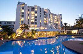 Luxury resort infinity pool at sunset