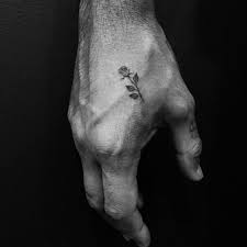Tiny Rose Tattoo On The Hand Small Black Rose Tattoo On The Right Hand Cool Tattoo Idea For M Small Tattoos For Guys Small Hand Tattoos Hand Tattoos For Guys