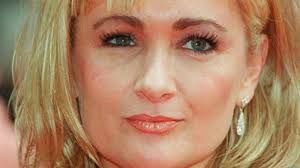 Actress and writer Caroline Aherne dies aged 52 at her home in Timperley