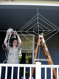 Spider webs and spiders' webs are both correct, but as in many cases when a noun is used as a modifier, the singular works just as well as the plural possessive, so that's what i'd choose: A Tangled Web Make Your Own Halloween Spider Web