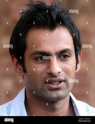 In this May 15, 2010 photo, Pakistani cricketer Shoaib Malik talks to media  in Lahore, Pakistan. Shoaib Malik's one-year ban from international cricket  is over after the Pakistan Cricket Board arbitrator on