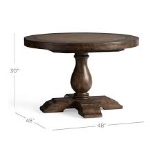 A dining table is where you enjoy a cup of coffee first thing in the morning spread out homework for the next day and where you gather the family for a warm meal to catch up with each other's lives. Lorraine Round Pedestal Extending Dining Table Pottery Barn