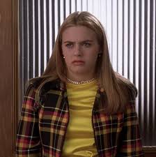 This outfit is straight up uggo.especially the weird black fur trim. Cher Wore Over 30 Outfits In Clueless And I Ranked Them All