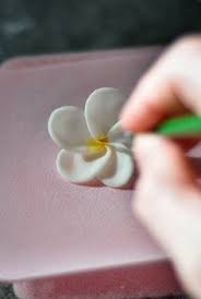 How To Make A Fondant Frangipani Flower Cake Decorating Tutorial Fondant Flower Fondant Flower Tutorial Sugar Flowers Tutorial