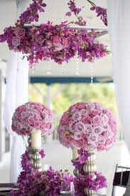 In spring and summer weddings while dark purples such as mauve, eggplant, royal purple etc. Hanging Flowers And Crystals Wedding Decorations Wedding Centerpieces Purple Wedding