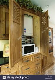 doors open to kitchen cupboard with