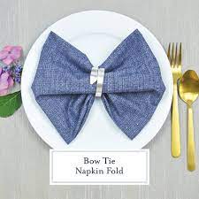You'll find a photo tutorial below. Bow Tie Napkin Fold Step By Step Photos Instructions