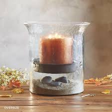 These are great for holding candles, displaying ornaments, lights, or shells or anything decorative. Blown Glass Hurricane Sundance Catalog