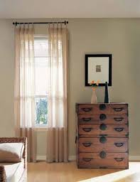 We're your local budget blinds, and we're passionate about providing innovative window treatment solutions. Soften Edges And Add Visual Interest To Your Windows By Layering Sheer Chemise Panels Over A Roller Shade Living Room Blinds Blinds Design Curtains With Blinds