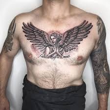 Stylish tribal cross chest tattoo. Familia Supra Omnia Tattoo Tattoos Chest Tattoo Men Wing Tattoo Men