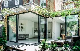 Get expert tips and inspiring ideas at hgtv.com. Sliding Floor To Ceiling Glass Doors That Open The Living Room And Kitchen To The Surrounding Garden Ter House Extension Design House Extensions House Exterior