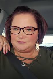 woman has fun at car wash photo shoot