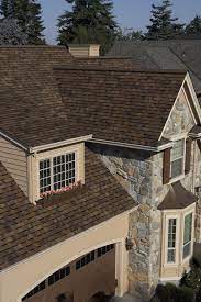 Duration teak a beautiful home with a new shingle color installed. Duration Brownwood Shingles House Roof Roof Shingles Shingle Exterior