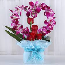 Even if you are away from your the flowers will signify your selfless love and show that you will be always there for her in time of need. Buy Send Romantic Heart Shaped Orchids Arrangement Online Ferns N Petals