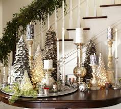 Lovely Display Of Tree Candles And Mercury Glass Trees And Pillar Holders By Pottery Barn Christmas Deco Christmas Table Centerpieces Holiday Table Decorations