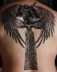Because it can be traced back to the church's most peaceful incarnation, this beatific icon transcends the violence of religion. Black Ink Archangel Michael On Celtic Cross Tattoo On Full Back