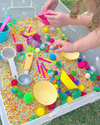 Cupcake Sensory Bin I Finally Took The Time To Dye Rainbow Rice For Sensory Play And It Was So Worth Kids Sensory Play Sensory Bins Toddler Sensory Bins