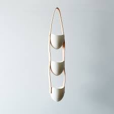 Cut three strips of leather cording long enough to hang your plant. 3 Tier Ceramic And Leather Hanging Planter On Food52