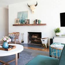 The gas fireplace is offset and because of that has never looked right to me. 10 Ways To Bring Together Rustic And Mid Century Modern Decor