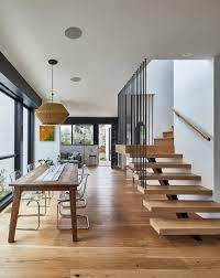 Photo 10 Of 17 In A Modern L A Home Mixes California Mediterranean Modern Dining Room Stairs In Kitchen Latest Dining Table Designs