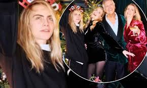 People who liked cara delevingne's feet, also liked Cara Delevingne Poses Alongside Sisters Poppy And Chloe And Father Charles For Christmas Snap Daily Mail Online