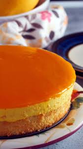 This Mango Mousse Cake Is A Decadent Cake Made Of A Moist Sponge Cake Topped With A Creamy Mango Mousse Mango Dessert Recipes Mango Dessert Mango Mousse Cake