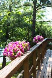 Tips to use fade resistant flowers for outdoor artificial landscaping and learn where to buy silk flowers! Lakeside Flower Box Deck Railing Planters In My Own Style