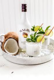 Malibu is a coconut flavored liqueur, made with caribbean rum, and possessing an alcohol content by volume of 21.0 % (42 proof). Coconut Mojito Malibu Rum Cocktail Is The Ultimate Happy Hour Drink For Entertaining This Twist On Cocktails With Malibu Rum Coconut Mojito Rum Drinks Recipes