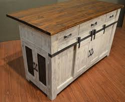 These kitchen island cabinets think outside the box—literally. Antiqued White Finish On Base Natural Pine On Top No Assembly Required Barn Doors With Function Kitchen Island Storage Kitchen Island Design Rustic Cabinets