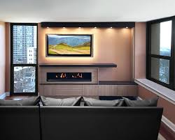 If you have enough space, you can place end tables beside the love seats for extra storage and table space. Custom Entertainment Center And Fireplace Surround