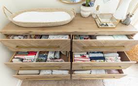 The large shelves provide plenty of storage space for towels, diapers and other supplies. Nursery Dresser Organization Tried True Tips Kelley Nan