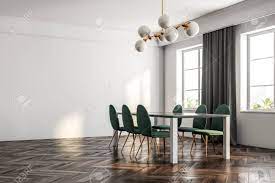 Ammonia is used as a staining agent in woodworking, and it can stain the wood a permanent black. Minimalistic Dining Room Interior With A Dark Wooden Floor White Walls Large Windows With Curtains And A Table With Green Chairs 3d Rendering Mock Up Stock Photo Picture And Royalty Free Image