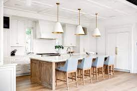 Homeadvisor's kitchen cabinet cost estimator lists average price per linear foot for new cabinetry. Powder Blue Stools At Wooden Island Transitional Kitchen