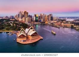 Pinkish Colourful Sunrise Over Sydney City Cbd On Waterfront Of Harbour Around Circular Quay With Major Architectural La Australia Travel Sydney City Australia