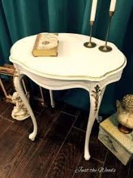 While this beautiful, sturdy furniture isn't white, it does utilize lovely white upholstery to balance the deep brown of the wood. How To Add Gold Leaf To Painted Furniture For An Elegant Effect