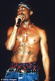 Rihanna dedicates new stomach tattoo to grandmother dolly 9 musicians tell the stories behind their favorite tattoos top 12 the absolute worst tattoos in hip hop history video a ap rocky sextape leaked nsfw jukebox dc iggy azalea removes tattoo of ex boyfriend a ap rocky photo a ap rocky interview just your average harry potter reading. Rihanna Scribbles Thug Life Across Her Midriff In Memory Of Tupac At Coachella 2012 Daily Mail Online