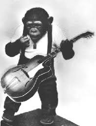 This is a brass statue. Monkey Playing Guitar Gretsch Talk Forum