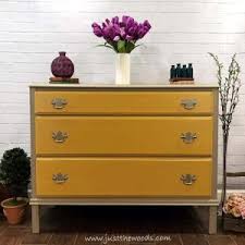 A beautiful distressed yellow dresser. How To Update Your Old Furniture With Yellow Dresser Drawers