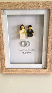 A Lovely Gift For The Happy Couple Different Hair Can Be Chosen For The Figures To Make The Frame More Personal Ple Lego Frame Diy Wedding Gifts Lego Wedding