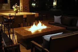 Combining a fire pit with a coffee or dining table marries the best of both worlds into a focal piece that invites friends and family to relax and settle in for a night of great food and conversation. Large Balboa Fire Pit Table Mediterranean Patio San Diego By Cooke Furniture