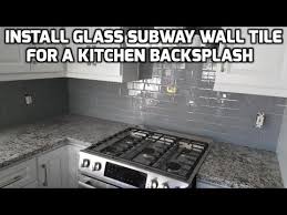 Notch the adhesive strips, if necessary, to fit around obstacles. Install Glass Subway Wall Tile For A Kitchen Backsplash Youtube