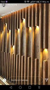 This wall is made up of small pallet wood planks and different colors are infused in it to make it more beautiful and natural. Pin By Yana Petruhan On Revestimiento Acabados Wall Panel Design Wall Design Interior Wall Design